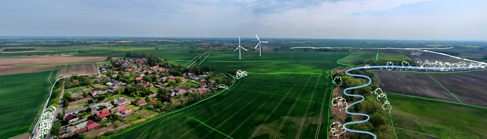 Ein Luftbild von Felde und einem Dorf mit geplante Veränderungen angezeichnet